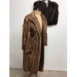 A 1950s Fox fur swing coat together with a 1930s fur bolero capelet.