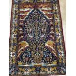 A Persian style tree of life wool rug W:125cm x H:187cm
