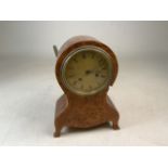 A French walnut cased balloon shaped mantle clock. W:23cm x D:11cm x H:32cm