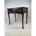 A Georgian mahogany lowboy side or serving table on pad feet. Three drawers to front with original