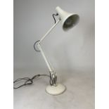 An Anglepoise desk lamp with adjustable angle and height function.