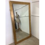 A large modern gold framed mirror. W:100cm x H:180cm.