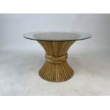 McGuire, San Francisco. A glass topped coffee table with twisted bamboo base. Glass top: W:64cm.