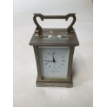 A Garrard & Co gilt brass mantle clock. 12cm(h) currently running with key.