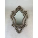 A knot work pierced wall mirror. W:44cm x D:2cm x H:77.5cm