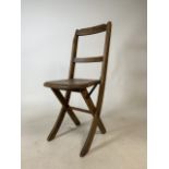A small Victorian childs folding chair. W:26cm x H:67cm D:27cm