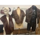 A collection of fur shawls including fox, squirrel and mink.