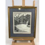 A pen and ink framed sketch of a house and garden. Signed bottom right corner: G.H.L Baldwin. W:39cm