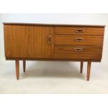 A mid century sideboard by Schreiber. Cupboard to shelf along side three drawers. W:122cm x D:43cm x