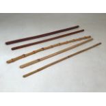 Five swagger sticks. Made from Bamboo and light brown leather casing.
