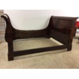 A mahogany sleigh bed. W:202cm x D:138cm x H:108cm