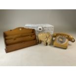 A letter rack, vintage telephone and wicker basket and other items.