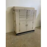 A Baisch mid century industrial style dental cabinet with steel beige powder coated body, glass