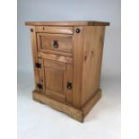 A modern solid pine bedside cupboard with drawer. W:54cm x D:39cm x H:67cm