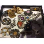 A collection of Scottish style brooches to include hard stone examples by Miracle