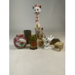 A selection of ornamental china to include a Crown Staff bird, ginger jar Russian dolls et
