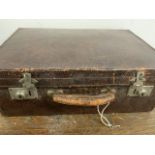 A Vintage leather suitcase. W:46cm x D:31cm x H:17cm