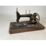 A Housewife s delight sewing machine with mother of pearl detailing.