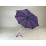 A Paragon Fox & Co parasol with early plastic handles and collars stamped NP.