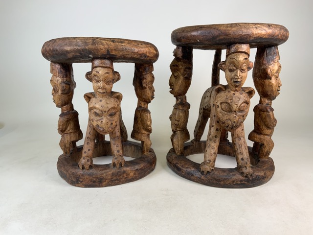 A matched pair of late 19th early 20th century West African (Yaruba) carved hard wood ceremonial