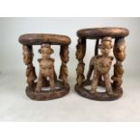 A matched pair of late 19th early 20th century West African (Yaruba) carved hard wood ceremonial