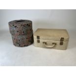 Two vintage travelling womens suitcases. Circular hat case is by Munro with fur belts inside. The