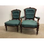 A pair of Victorian ladies and gentleman's bedroom chairs with carved details, button back