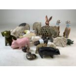 A collection of ceramic, soapstone and pottery animal figurines