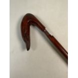 An eel head walking stick. H:88cm