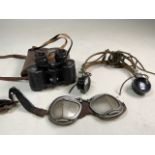 A pair of flying-motorcycle goggles marked Staduim Pat.Pend. Bakelite headphones also with Zeiss