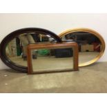 An Edwardian over mantle mirror and two oval mirrors. W:75cm x H:42cm