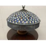 A Tiffany style lampshade on turned mahogany base. W:44cm x D:44cm x H:33cm