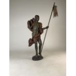 A late 17th or early 18th century style wooden religious figure with banner. H:57cm.