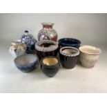A collection of jardinieres and Oriental style pottery.