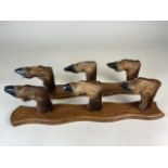 A pair of taxidermy gun rack or coat hook wall mounts. Six Deer hoofs on oak panels. W:53cm x D:10cm