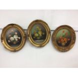 Three oils on board of floral subjects in gilt frames. W:29cm x H:34cm
