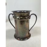 A silver plated arts and crafts style twin handled vase with planished decoration. W:23cm x D:14.5cm