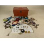 A Japanese style jewellery box with a quantity of costume jewellery.