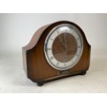 An eight day mantle balloon domed clock by Alexander Clark Co and a Smith movement (engraved K6A