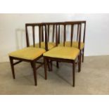 A set of four mid century dining chairs by A Younger with retro mustard seat upholstery. W:48cm