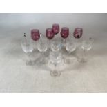 Six wine glasses by Royal Doulton with five glass cocktail stirrers with animal tops plus five