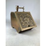 An art nouveau brass coal box with separate metal liner with matching shovel.