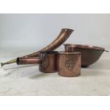 A collection of copper items to include a hunting horn on brass stand, a tea caddy , mixing bowl and