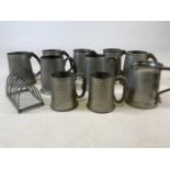 Ten pewter tankards and a toast rack. Howard and English pewter.Largest W:10cm x D:10cm x H:12cm