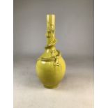 A late 19th early 20th century Oriental yellow ceramic dragon vase. Staple repair to neck .W: