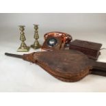 A carved wooden box, antique bellows a modern reproduction telephone and a pair of brass