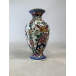 A 1960s Velsen hand painted art pottery vase. Delft polychrome Signed on bottom. Height 31cm