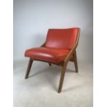 A mid century Scimitar style chair with orange leather upholstery.W:55cm x D:61cm x H:68.5cm