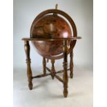 A Spanish globe on four wooden legged frame. H:100cm approx.