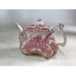 A Victorian Staffordshire Aesthetic movement teapot , transfer printed in pink with scenes of an